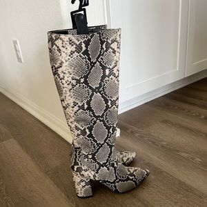 Snakeskin knee high boots